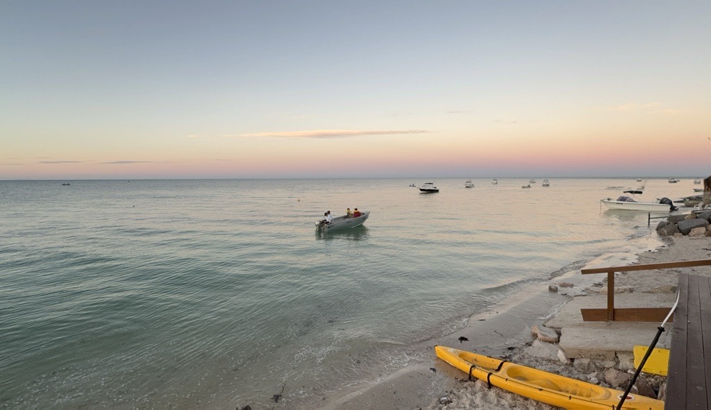 Sunset at Black Point beach with kayaks