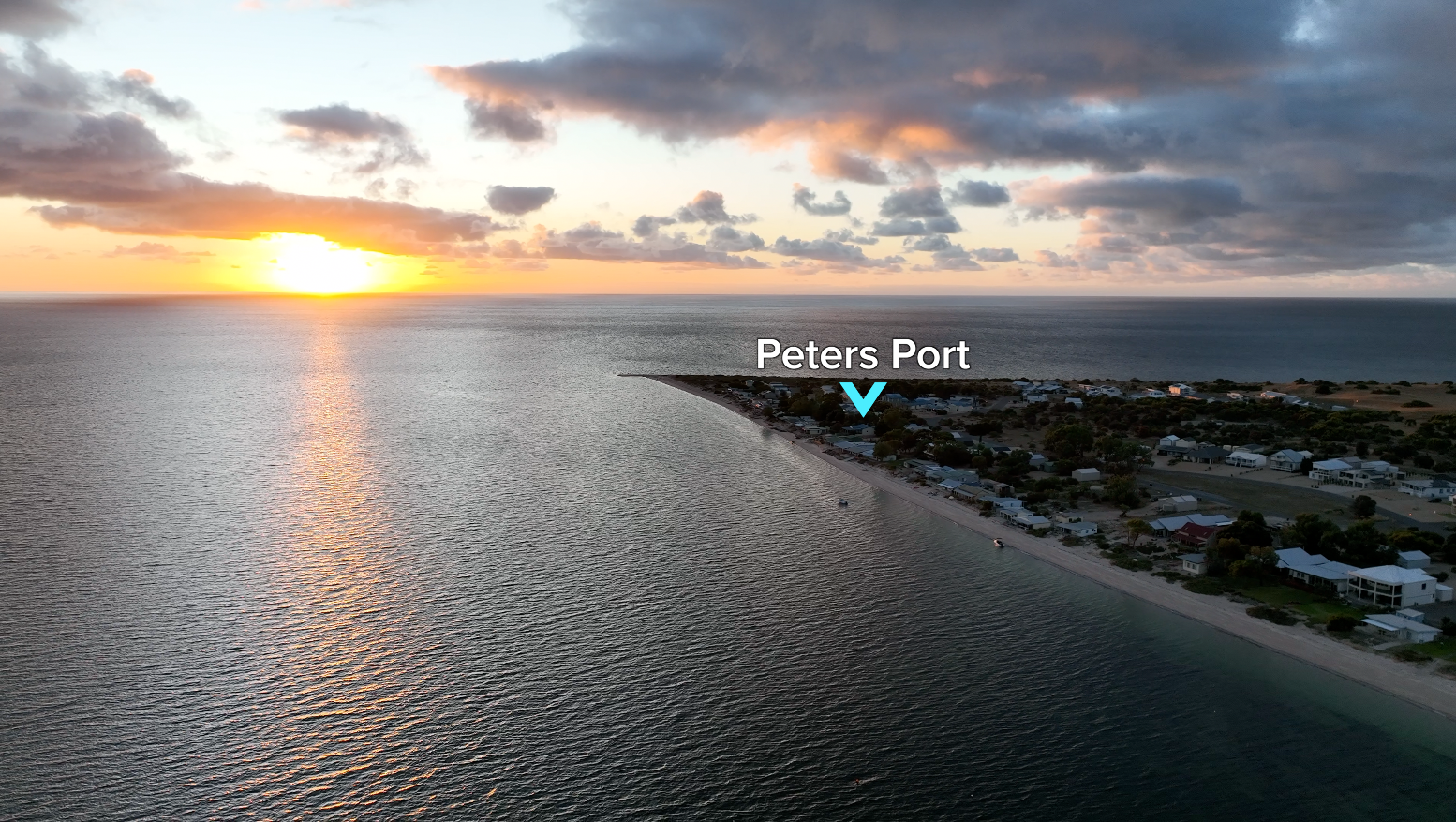 Aerial view of Peter's Port coastline showing absolute beachfront location at Black Point
